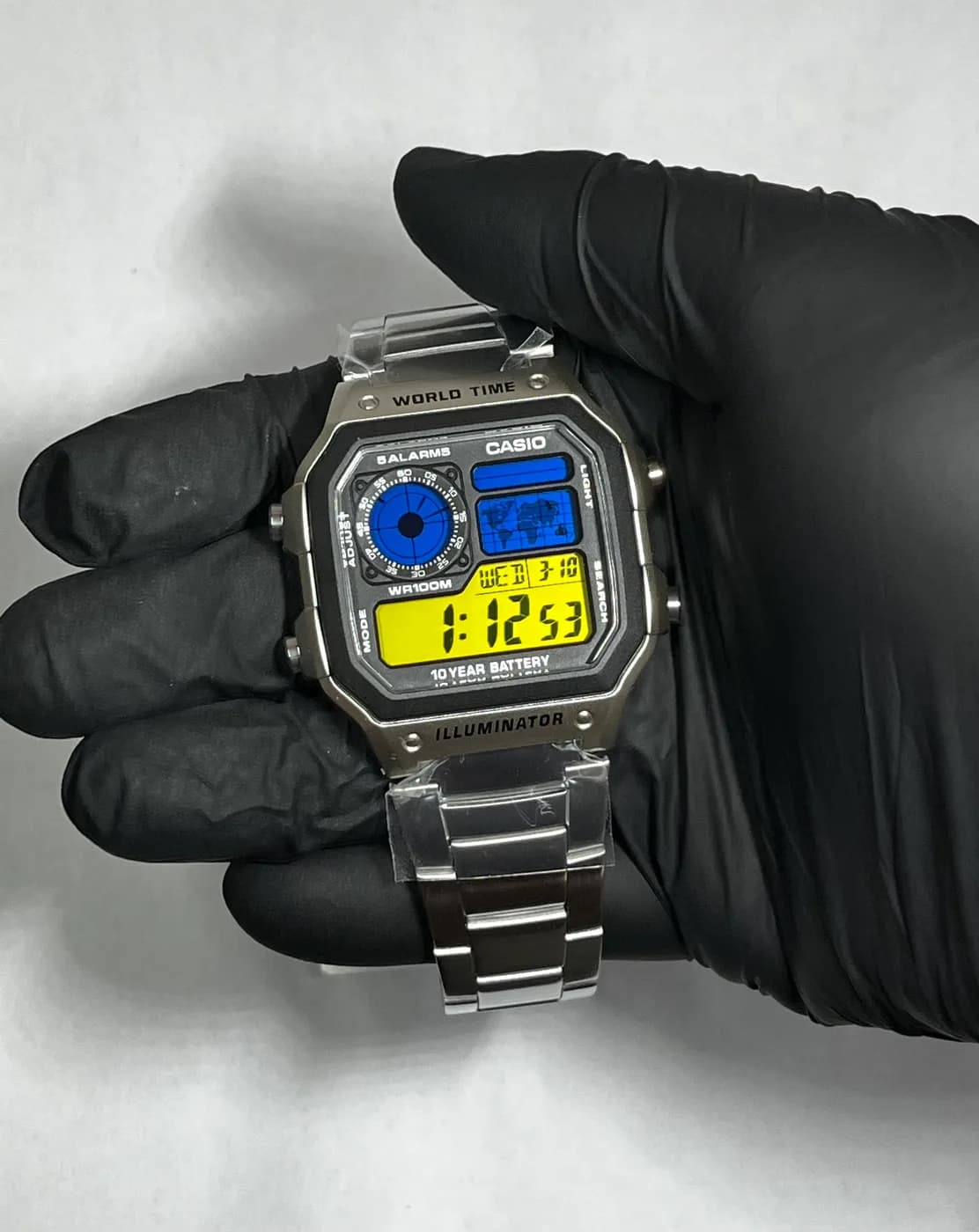 Casio AE1200 · Azul y Amarillo · Gradient