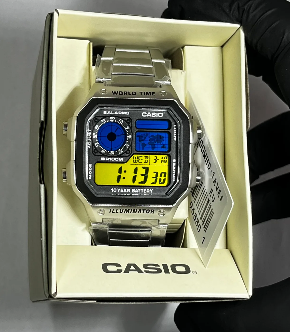 Casio AE1200 · Azul y Amarillo · Gradient
